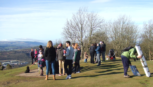 Folk gather around 'Aslan's Table' on Kinnoull Hill, to watch the Eclipse.